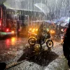 Motorists drive through the heavy rains in the Kibera Slums on March 14, 2026 in Nairobi, Kenya. At least 25 people have died after heavy rains caused devastating flash floods in Nairobi and other parts of Kenya this weekend.
