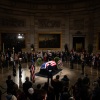 The flag-draped casket of former President Jimmy Carter lies in state in the U.S. Capitol in Washington, DC in the evening of Jan. 7.