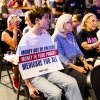 An attendee props up a sign with Democratic U.S. Senate candidate Abdul El-Sayed's slogan highlighting his progressive policy of Medicare for All on July 25 in Ferndale, Mich.