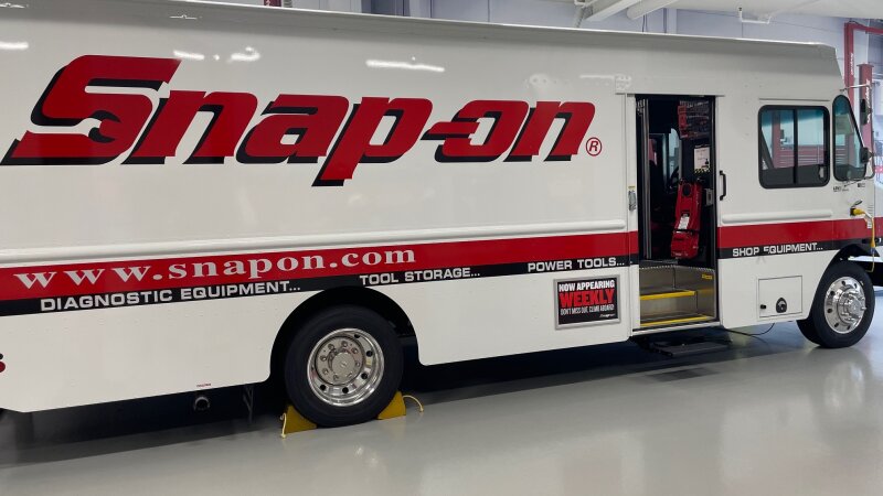 A long white truck says "Snap-on" on the side.