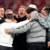 PSG's head coach Luis Enrique, center, celebrates with the other members of the team after the Champions League semifinal second leg soccer match between Bayern Munich and Paris Saint Germain in Munich, Germany, Wednesday, May 6, 2026.