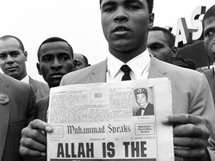 In this Nov. 22, 1965 file photo, heavyweight champion Muhammad Ali holds a