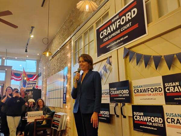 Dane County Judge Susan Crawford, candidate for the Wisconsin Supreme Court, prepares to speak at a campaign stop at Racine County Democratic Party headquarters.