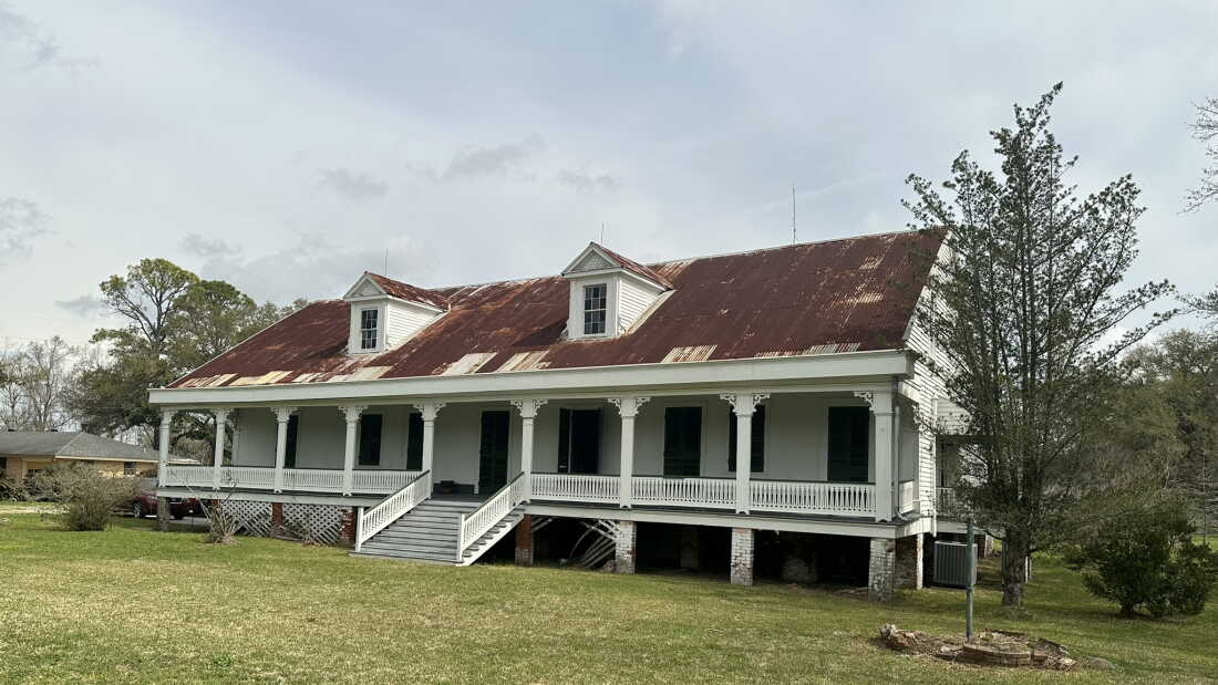 The Woodland Plantation House sits near the banks of the Mississippi River in LaPlace, La. The raised creole-style building with a rusty tin roof and wide front porch has Black owners for the first time. The site is historically significant because it's where one of the largest slave revolts in U.S. history began.