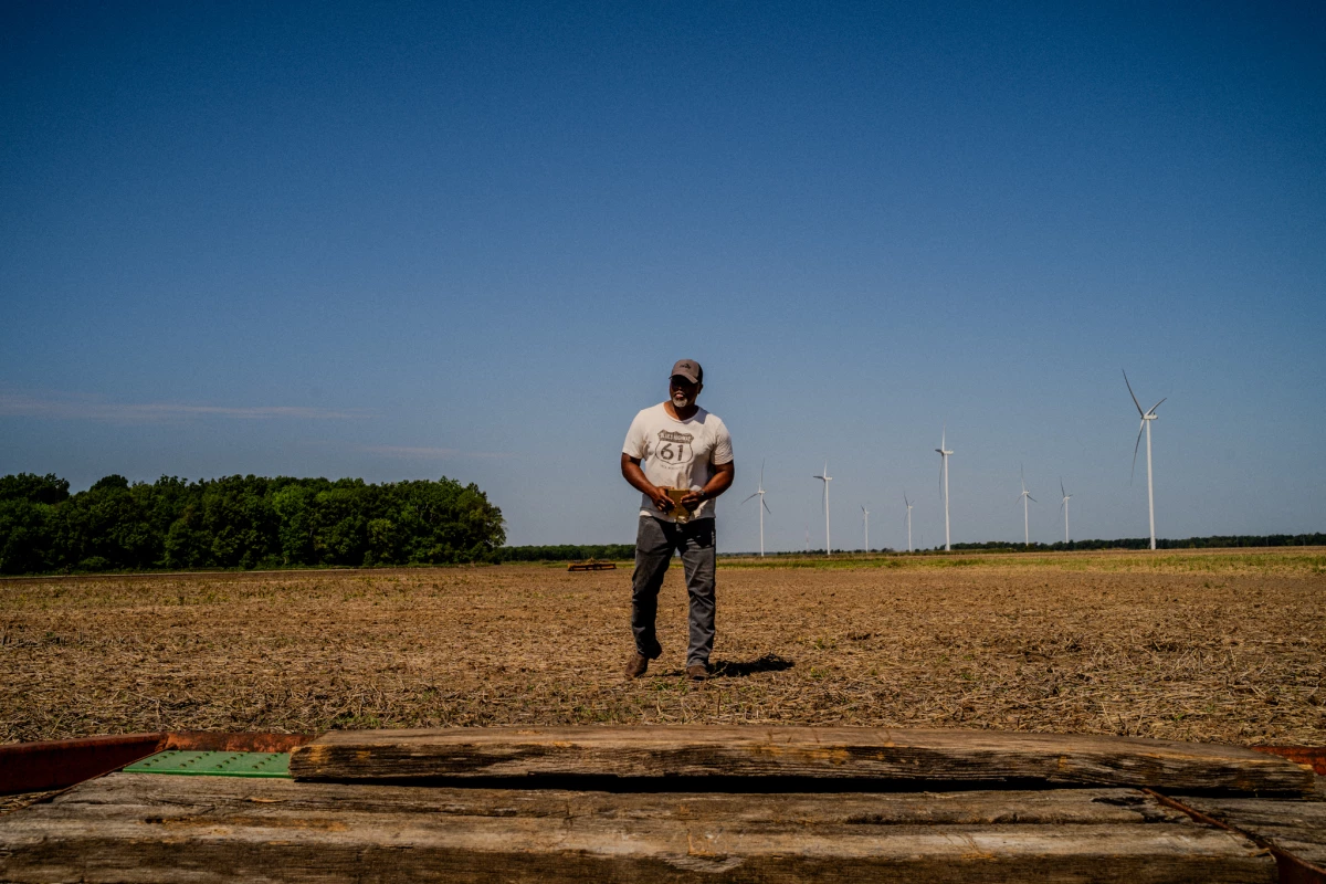Anthony Bland walks one of the fields he'll plant soybeans in on Friday, April 17, 2026. Bland used to grow rice as one of his main crops, but retaliatory tariffs placed by other countries in response to President Trump's tariffs have caused the price of rice to plummet, so he's pivoted to growing more soybeans.