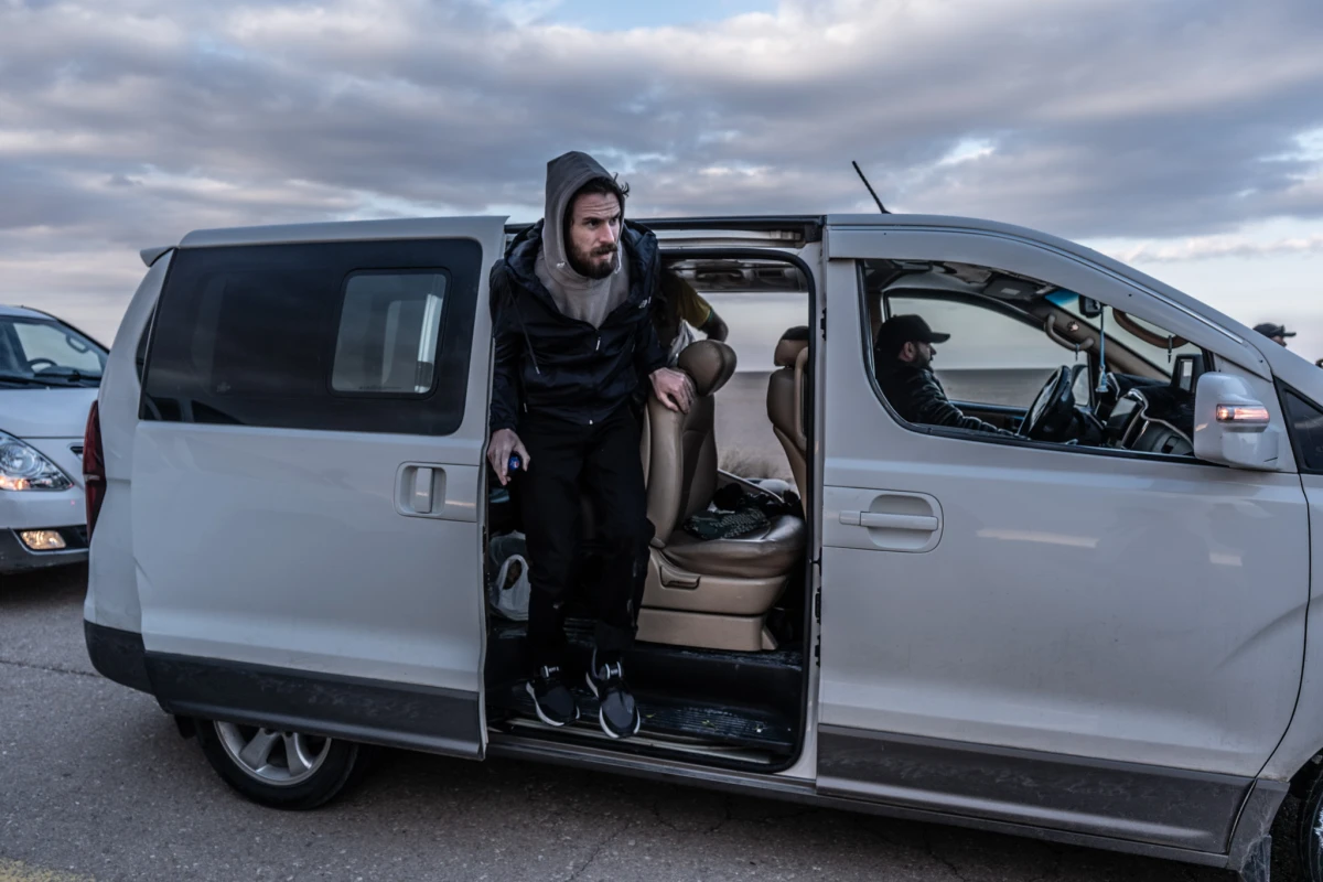 Timmerman gets out of a van ahead of his transfer to U.S. forces on the desert highway on Friday.