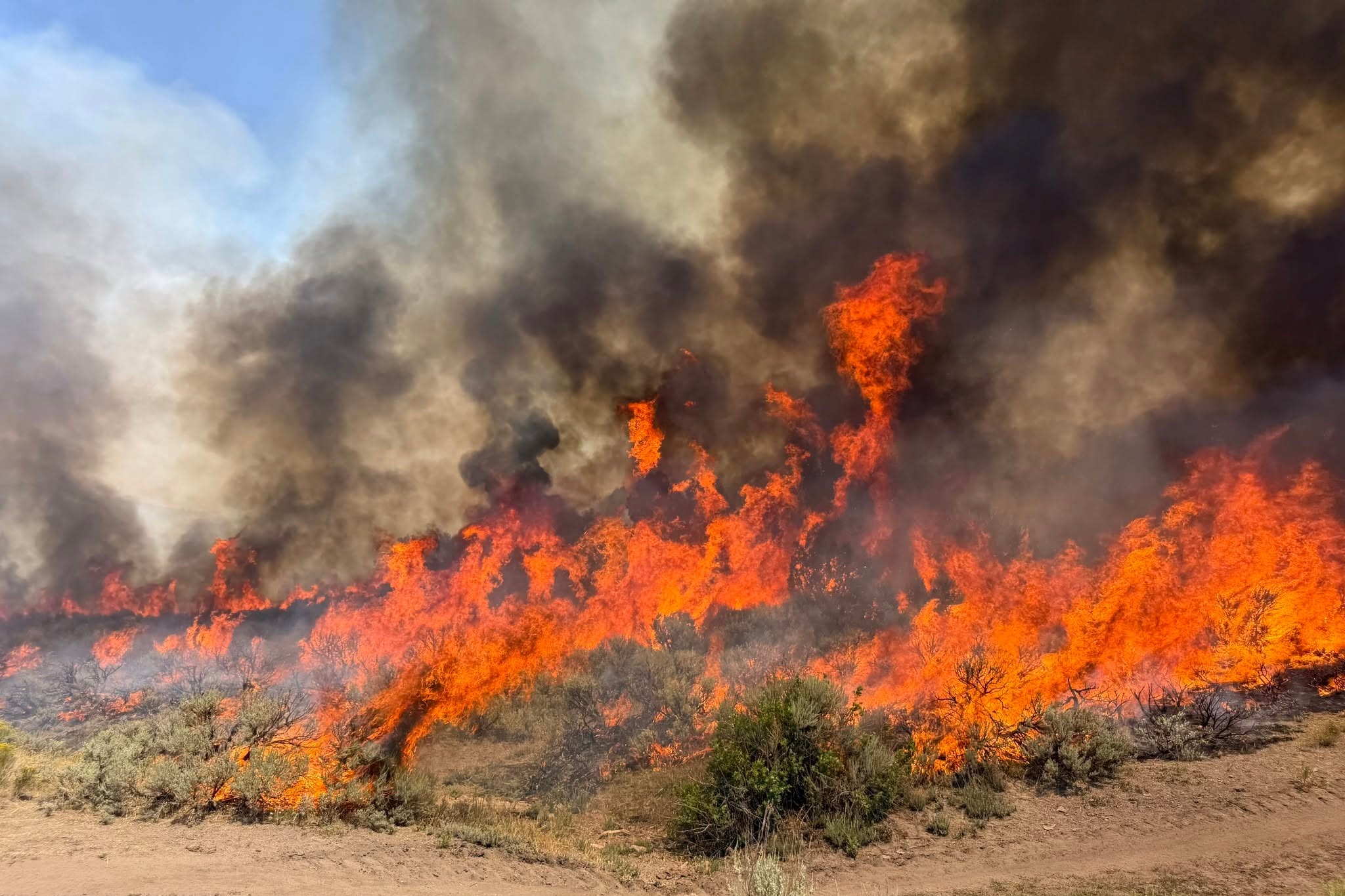 Crews battle wildfires in western U.S. and Canada