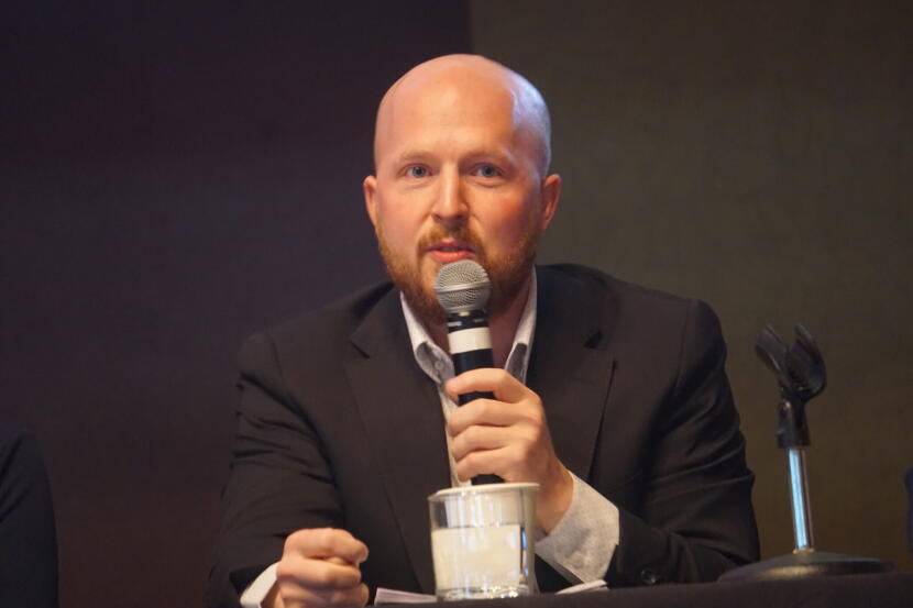 Former State Rep. Jonathan Kreiss-Tomkins, a Democrat, speaks at a gubernatorial candidate forum held in Girdwood on Sept. 16, 2026, by the Alaska Hospital and Healthcare Association.
