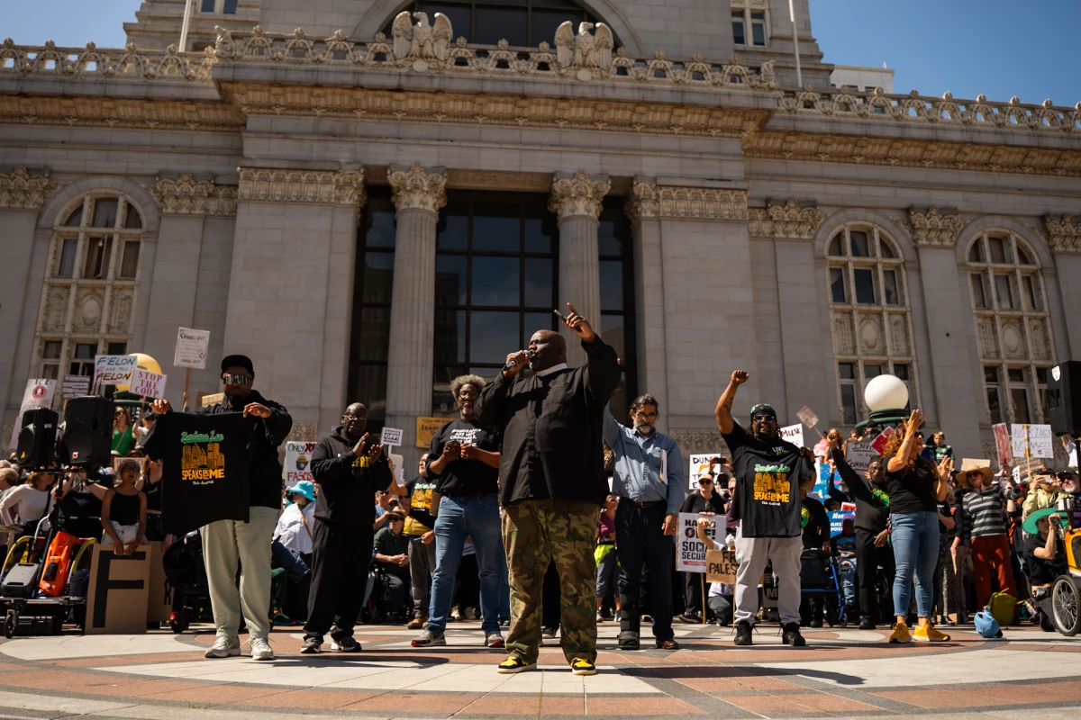 Pastor Michael McBride leads a chant during a Hands Off! rally in Frank Ogawa Plaza on April 5, 2025.