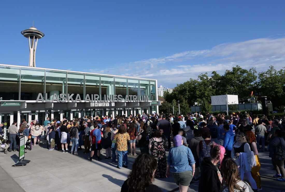 Hundreds of fans line up outside Seattle's Climate Pledge Arena to watch Dimension 20's live show in July of 2025.