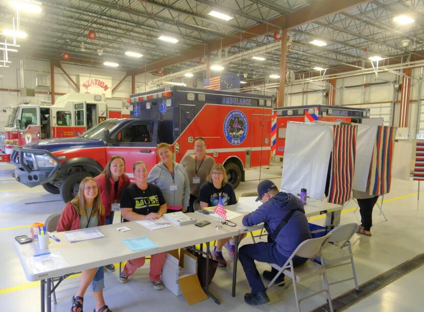 Poll workers pose for a photo at the polling site at the Mat Su Fire Station 5-1 in Palmer on primary Election Day on Aug. 18, 2026.