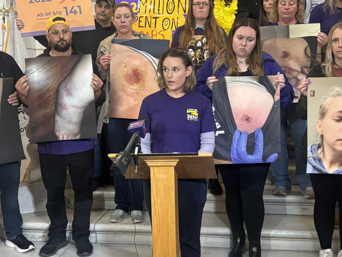 Catherine Maynard, a nurse at Butler Hospital, speaks at a union rally at the State House in Providence, Rhode Island, on May 23.