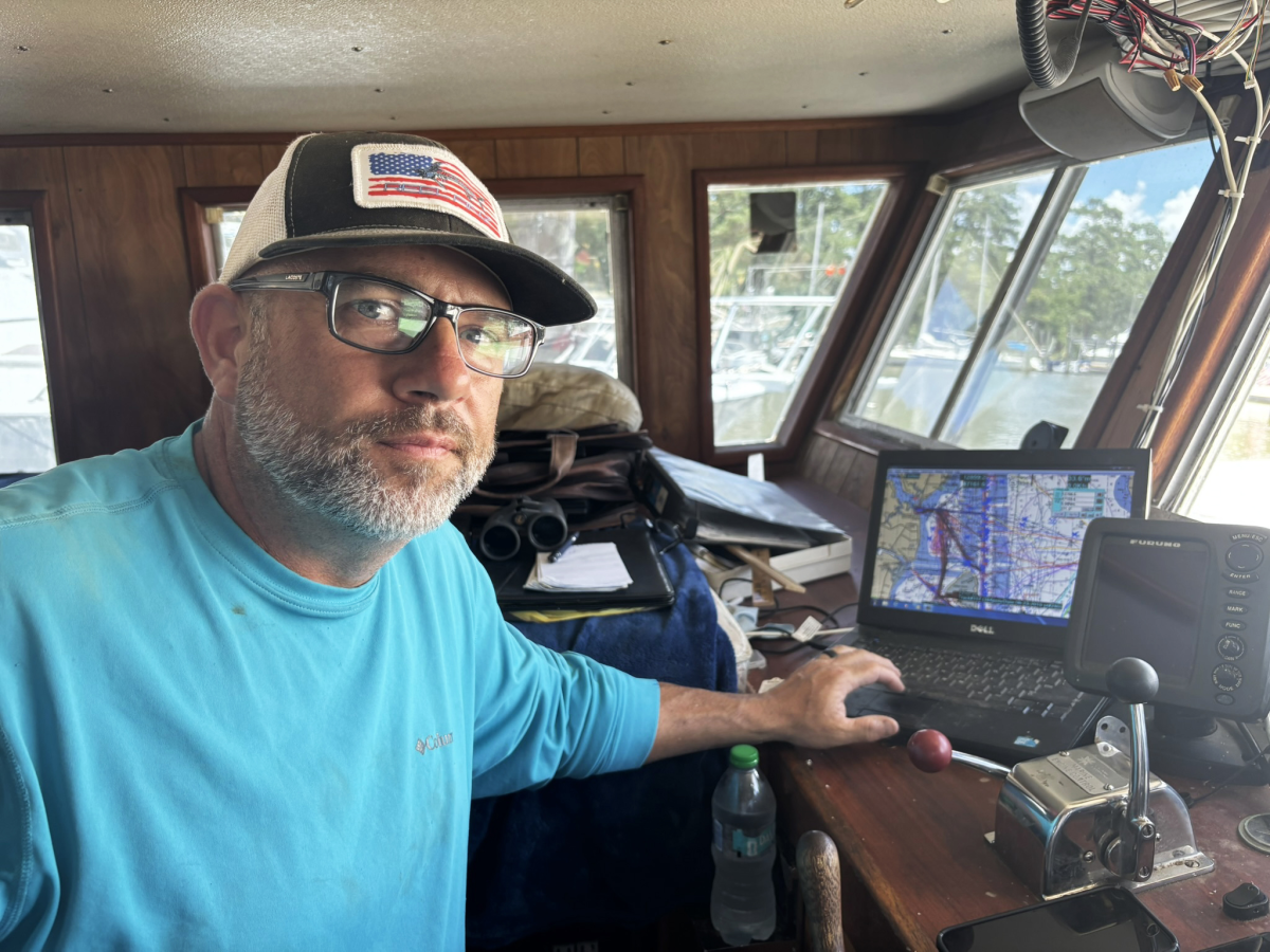 Gormandy in the cabin of his shrimp trawler, the Captain Sam B. He says putting dredging material back into Mobile Bay is detrimental to the fisheries habitat.