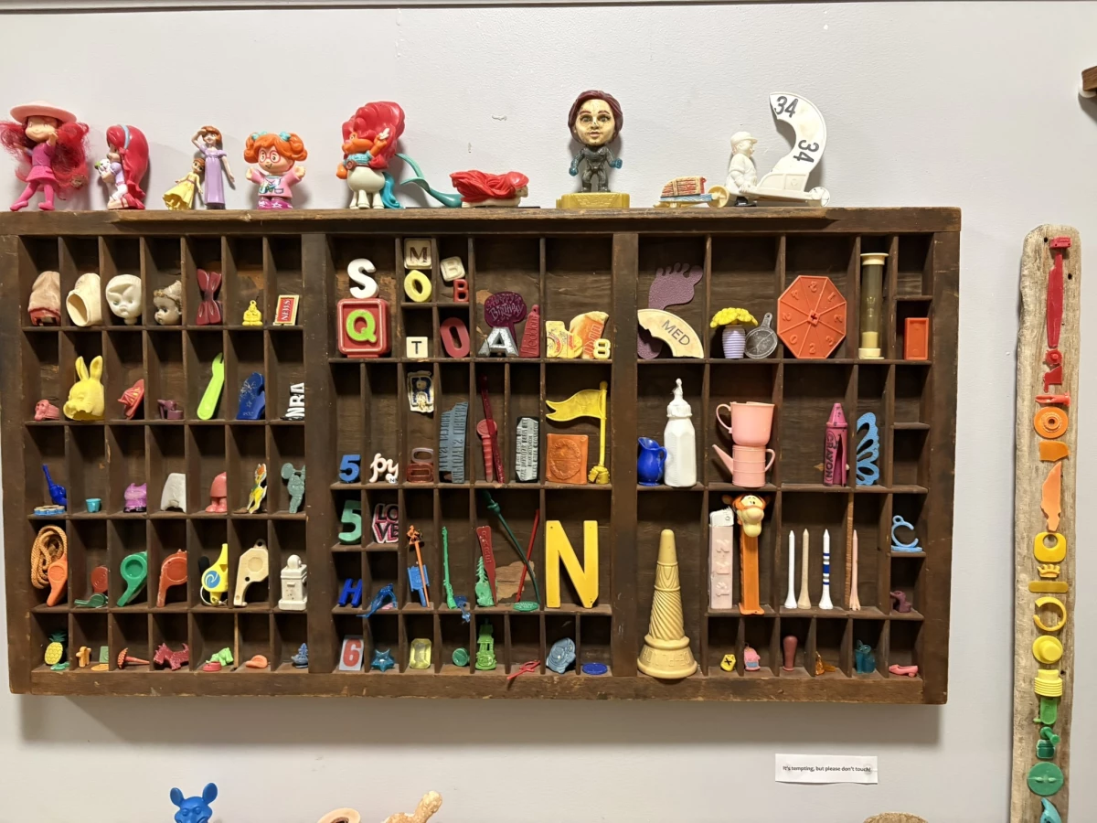 Pez containers, golf tees, the remains of printer's blocks and a sand timer are among the items collected from the beach and displayed at the Plum Island Museum of Lost Toys & Curiosities.