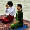 Aung San Suu Kyi, right, and her youngest son Kim Aris pay respect to the late Gen. Aung San, father of Suu Kyi, at the Martyr's Mausoleum in Yangon, Myanmar, Tuesday, July 12, 2011.