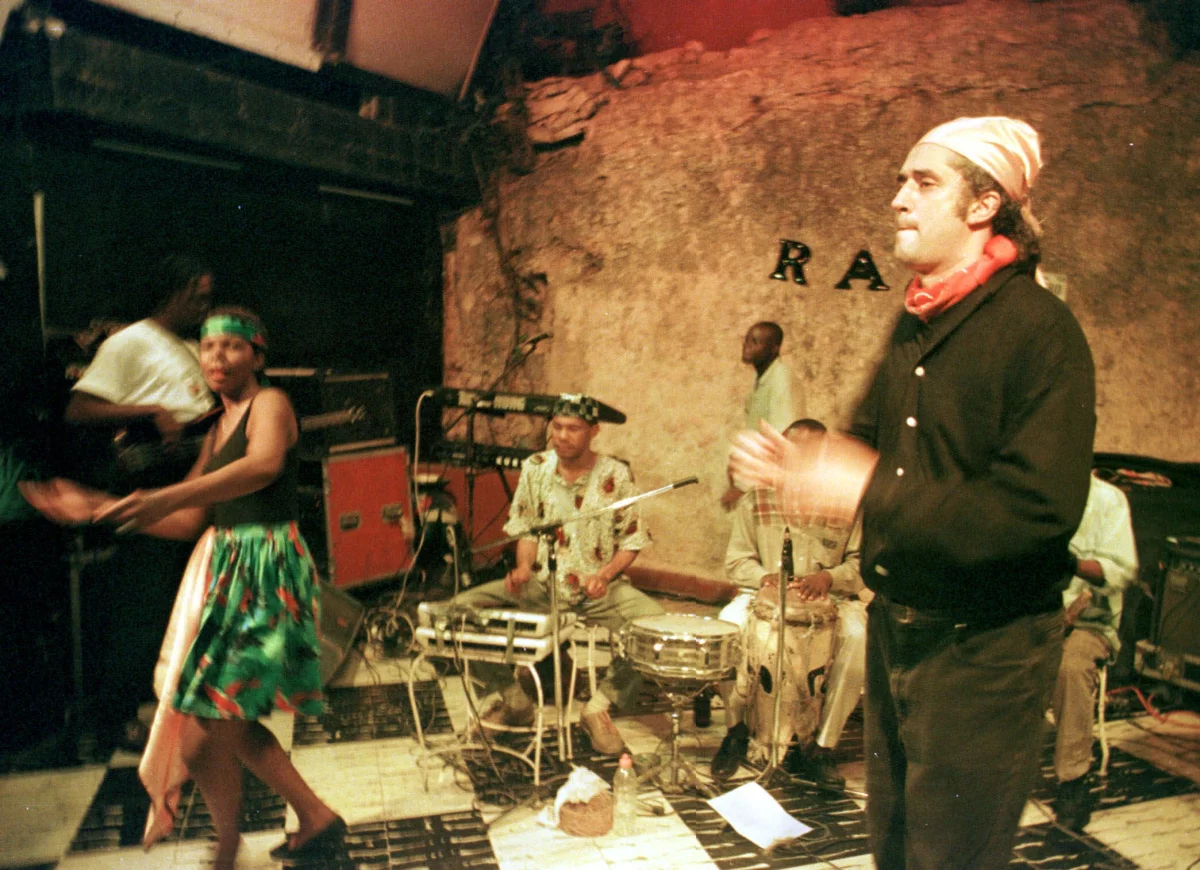 Richard Morse, right, sings with his group, Ram, at the famous Hotel Oloffson on Port-au-Prince, Haiti, Jan. 20, 2000.  Morse, the son of an American scholar and a Haitian dancer who grew up in Woodbridge, Connecticut, is the latest in the Oloffson's long line of operators.