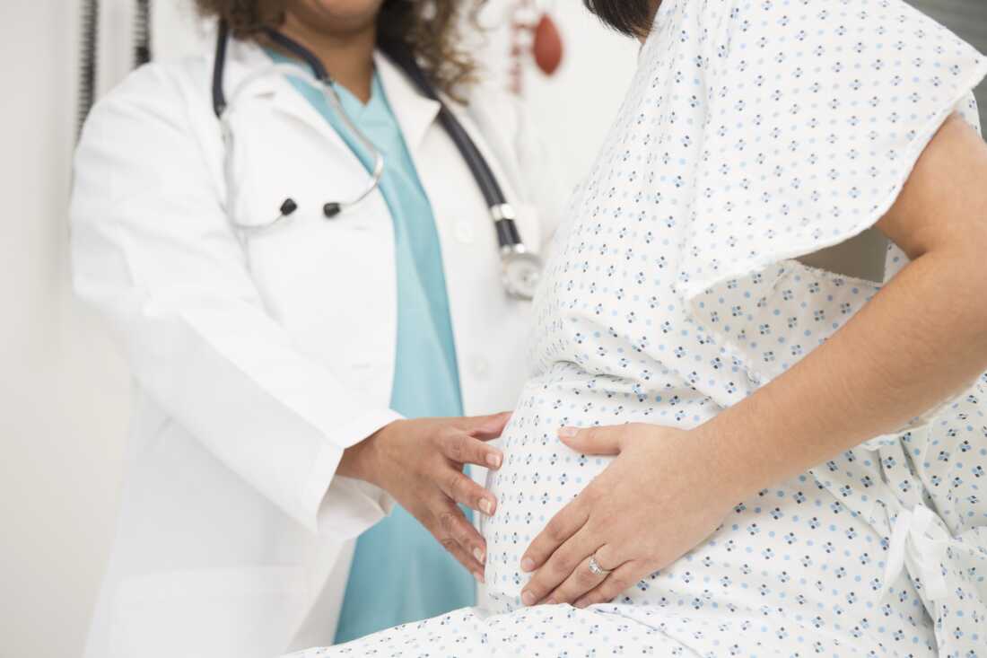 pregnant woman with doctor