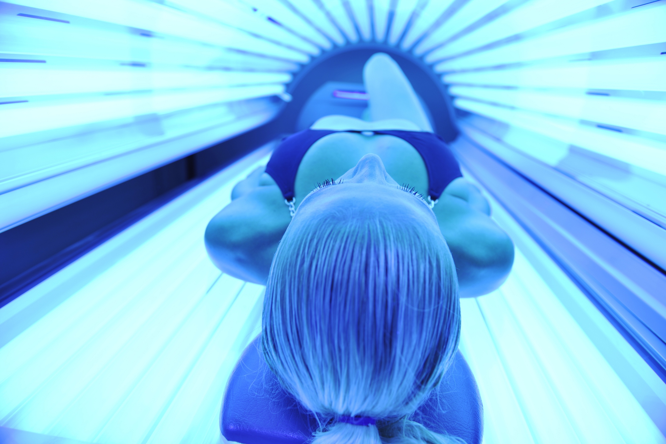 People who regularly use tanning beds are more likely to have DNA damage that can lead to melanoma across nearly the entire surface of their skin.