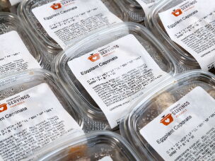 Containers of eggplant caponata from Community Servings are ready to be delivered to the homes of Boston-area residents who receive medically tailored meals.