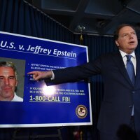 U.S. Attorney for the Southern District of New York Geoffrey Berman points to a photo of sex offender Jeffery Epstein on July 8, 2019, as he announces that Epstein was charged with sex trafficking minors and conspiracy.
