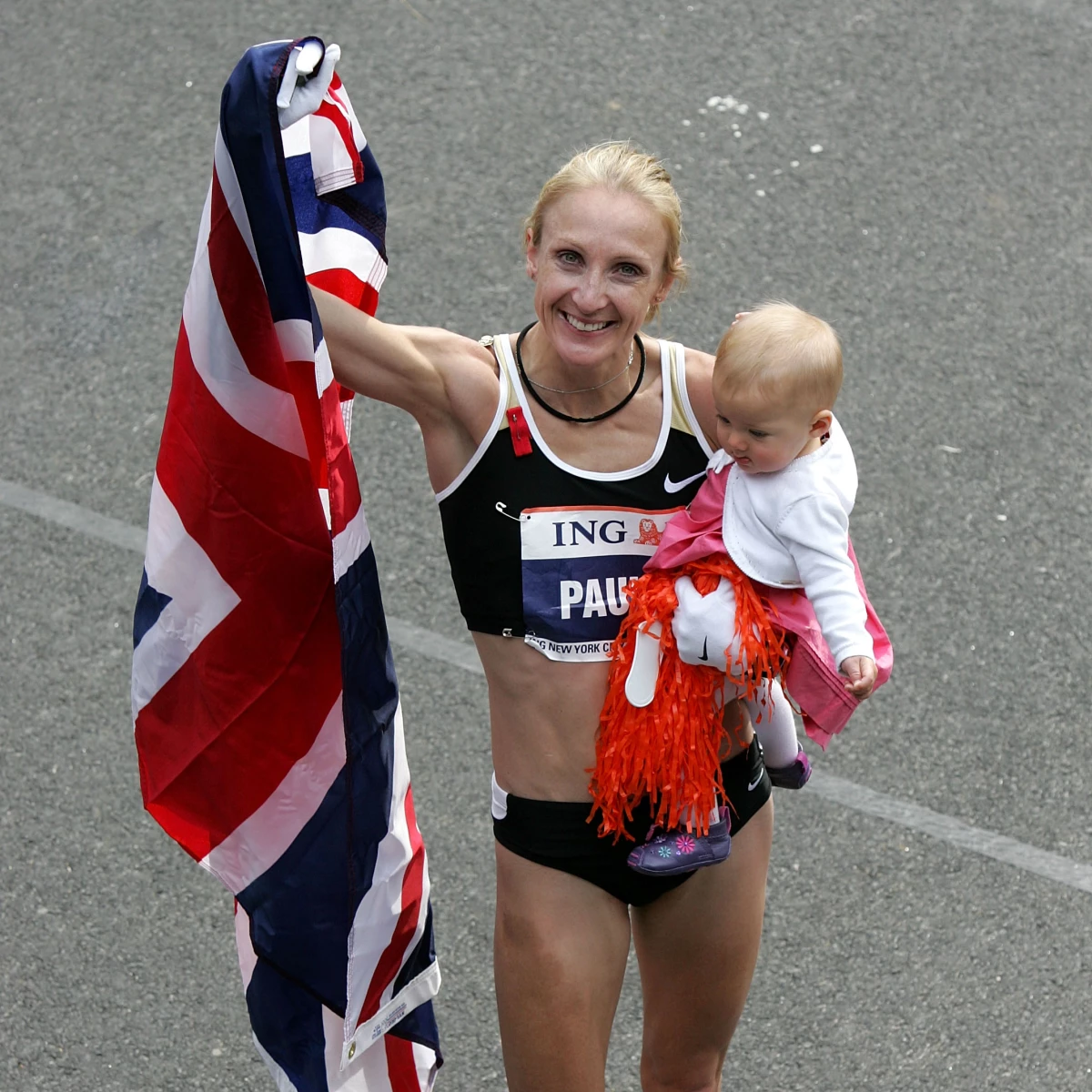 Paula Radcliffe celebrates with her daughter, Isla, after winning the women's division in the New York City Marathon on Nov. 4, 2007.