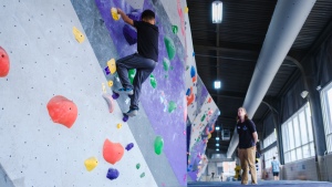 Student TKTK climbs a wall at TKTK ...