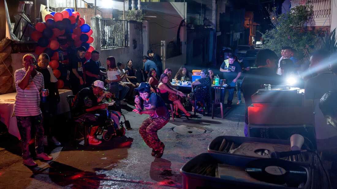 People dance at Brenda Cazárez’s 40th birthday party as Sonido Colombia plays music in the Privada Cusco neighborhood of Monterrey, Mexico, on Aug. 12, 2023.