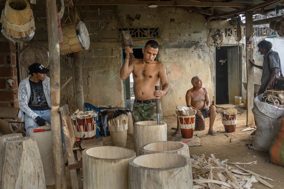 Carlos Casas Serrano makes a tambor alegre, a traditional drum used in cumbia, in the workshop of Colilo Lara on Aug. 12, 2022, in San Jacinto, Bolivar, Colombia, during the Festival Nacional Auntóctono de Gaitas.