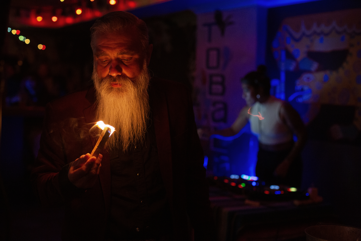 Campos lights a stick of palo santo to bring good energy to the room before a show at LA's Las Perlas bar on April 28, 2022.
