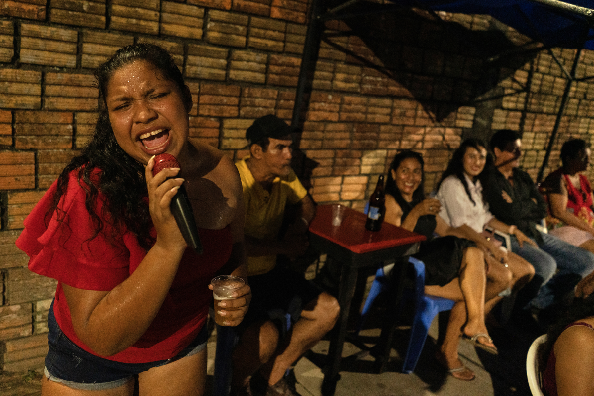 Estella Gonzalez, a member of Son Estrella, sings on the streets of Iquitos on Oct. 27, 2024, to promote the band.