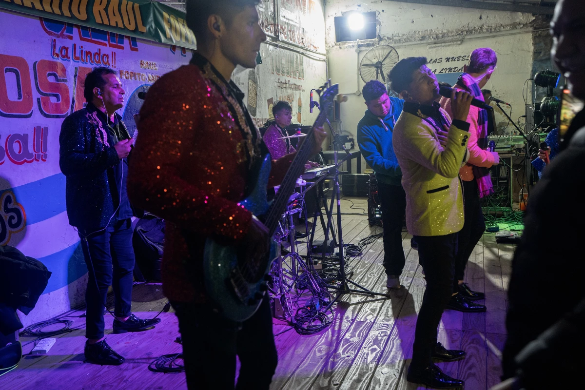 The band Bandy2 performs at La Peña de Mario Ibarra in Buenos Aires' La Boca barrio on July 28, 2024. The place is filled with lovers of northern cumbia.