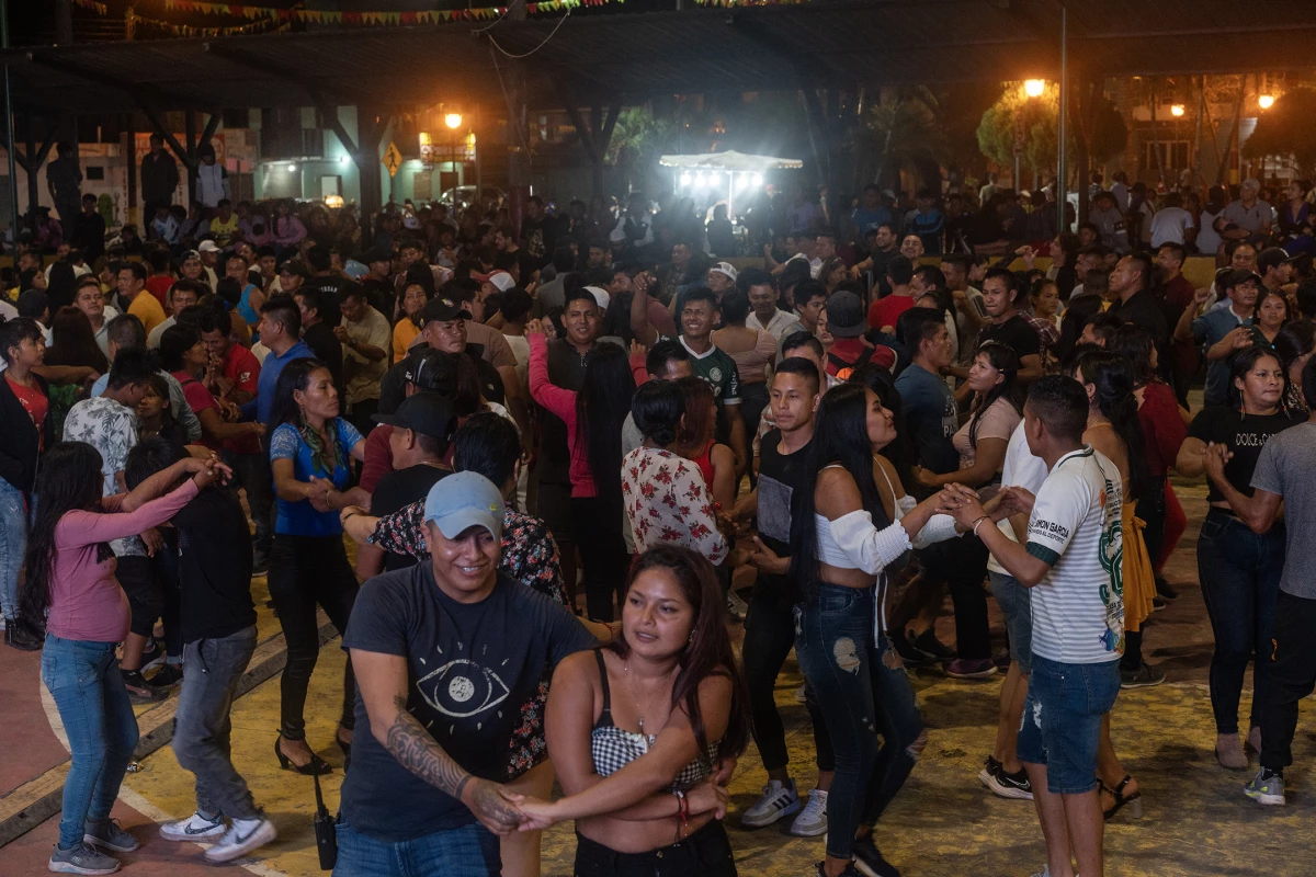 People from the town of Tiwintza, a district in Ecuador's Morona Santiago province, dance to the rhythm of the Los Cumbancheros orchestra on Oct. 24, 2023.