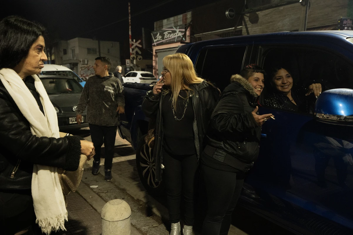 Fans of RocÃo Quiroz, a popular cumbia villera singer, gather to ask for her autograph as she leaves a concert on July 27, 2024. The show took place in the Conurbano, a suburban area surrounding Buenos Aires where many migrant communities live.