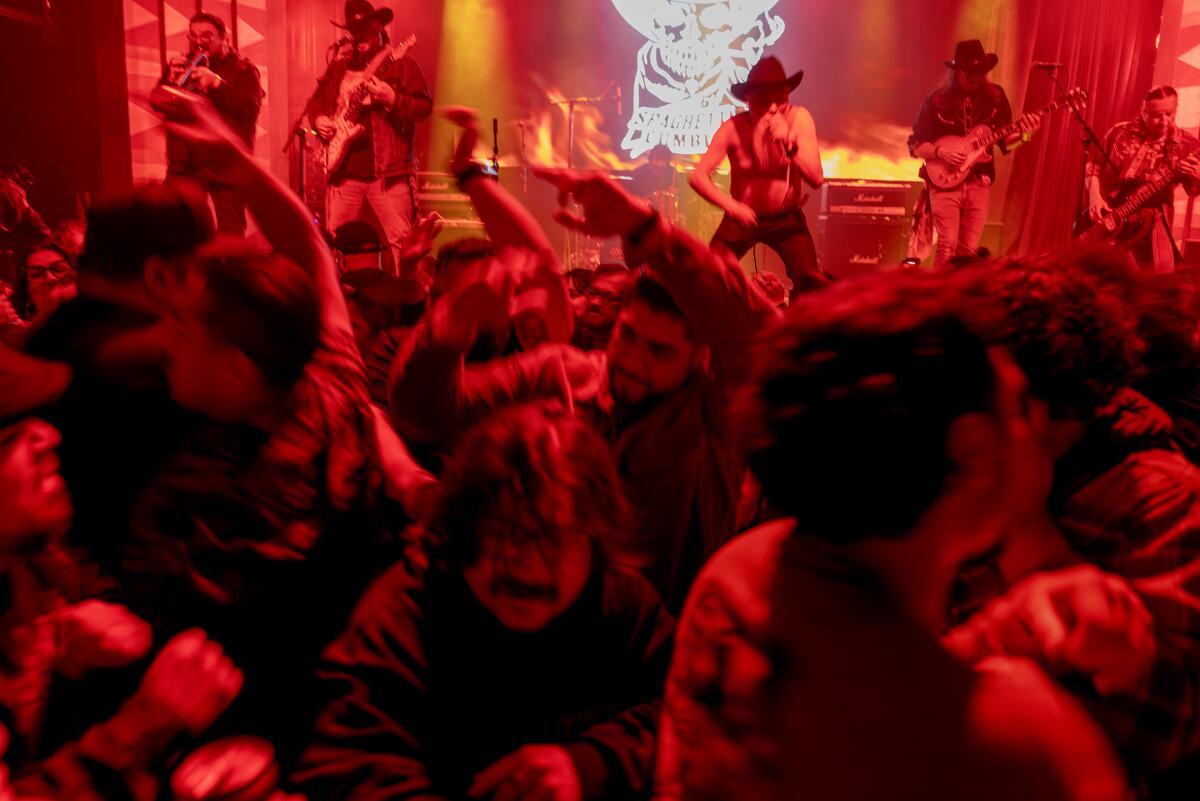 A mosh pit forms as Spaghetti Cumbia plays at LA's Regent Theater on March 8, 2025.