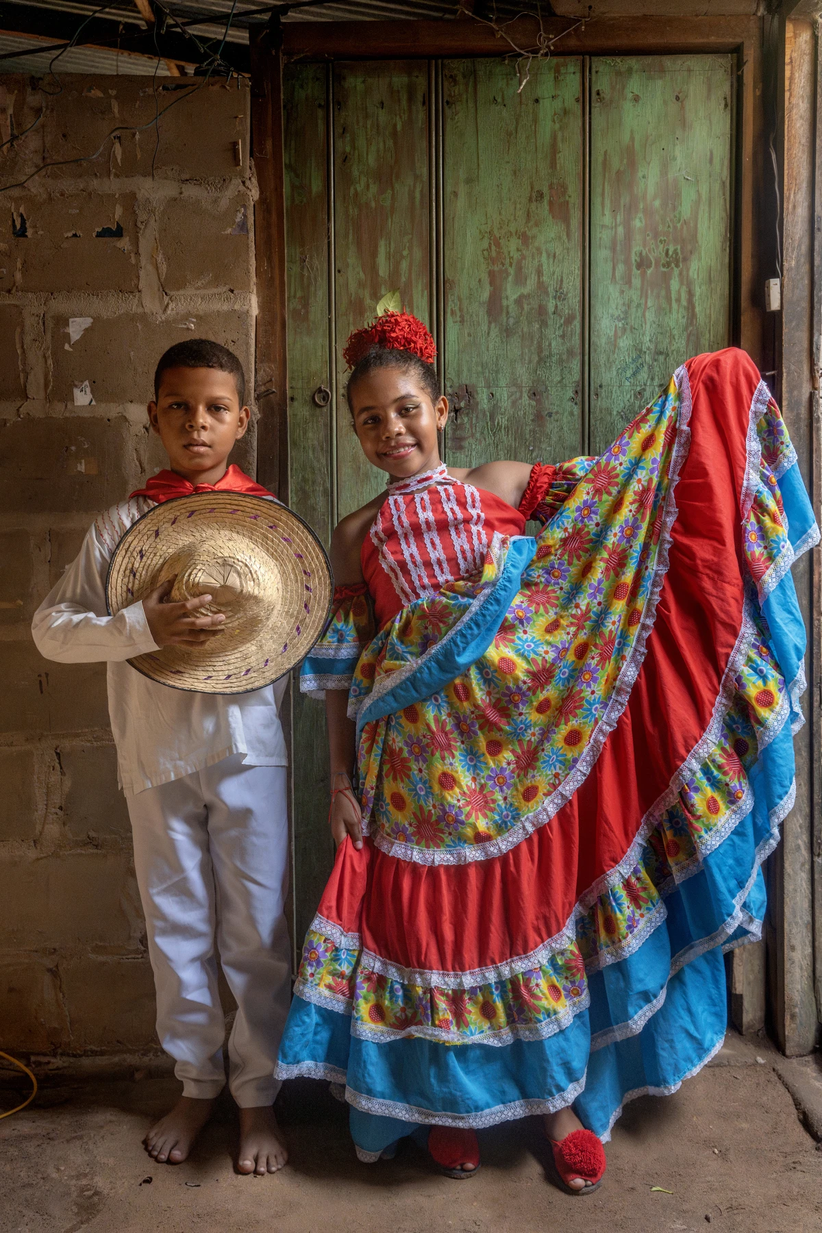 Yojan David Laguna Ospino and Jakelin Guillen Epalza, both 11, from the dance group Costa Azul Danza Indio Manzos, pose in the community of Playa Blanca in Guamal, near El Banco, Magdalena, Colombia, on Aug. 6, 2022.
