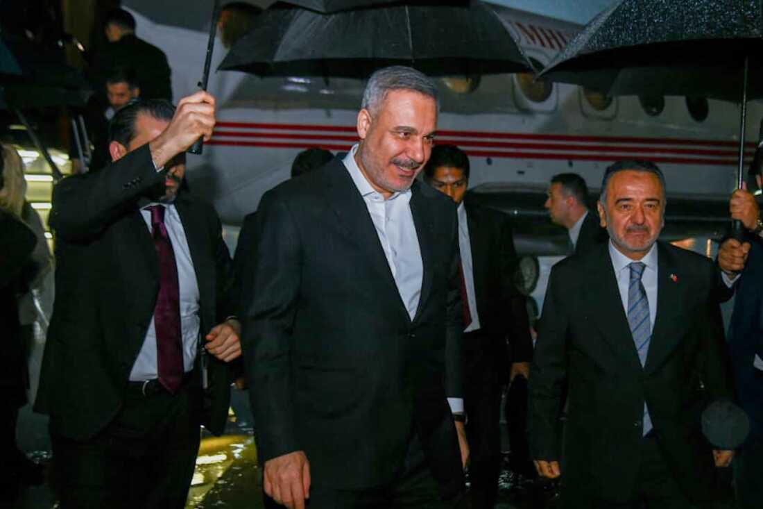 In this photo released by the Pakistan Ministry of Foreign Affairs, Turkish Foreign Minister Hakan Fidan, center, walks toward his car upon arrival to attend a meeting in Islamabad, Pakistan, Saturday, March 28, 2026.
