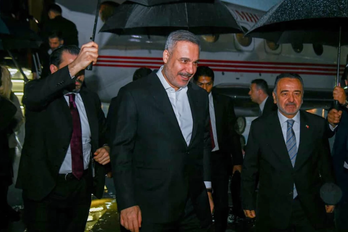In this photo released by the Pakistan Ministry of Foreign Affairs, Turkish Foreign Minister Hakan Fidan, center, walks toward his car upon arrival to attend a meeting in Islamabad, Pakistan, Saturday, March 28, 2026.