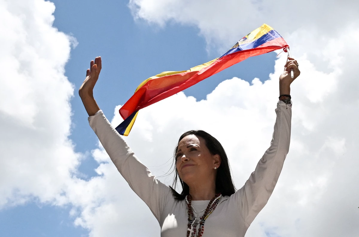 Venezuelan opposition leader Maria Corina Machado waves a Venezuelan flag during a rally in Caracas on August 28, 2024.