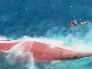 In this aerial image taken from video released by Indonesia's National Search and Rescue Agency (BASARNAS), the bottom of passenger ferry Virgo Transport 8 is seen above the water after it overturned in bad weather in the Java Sea, Sunday, Sept. 13, 2026.
