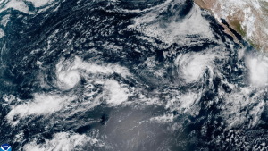 This satellite image from the National Oceanic and Atmospheric Administration (NOAA) shows Tropical Storm Nolo, left, south of Hawaii; Hurricane Odalys, middle, and Hurricane Polo, right, off the coast of Mexico, in the Pacific Ocean on Thursday, Sept. 24, 2026.