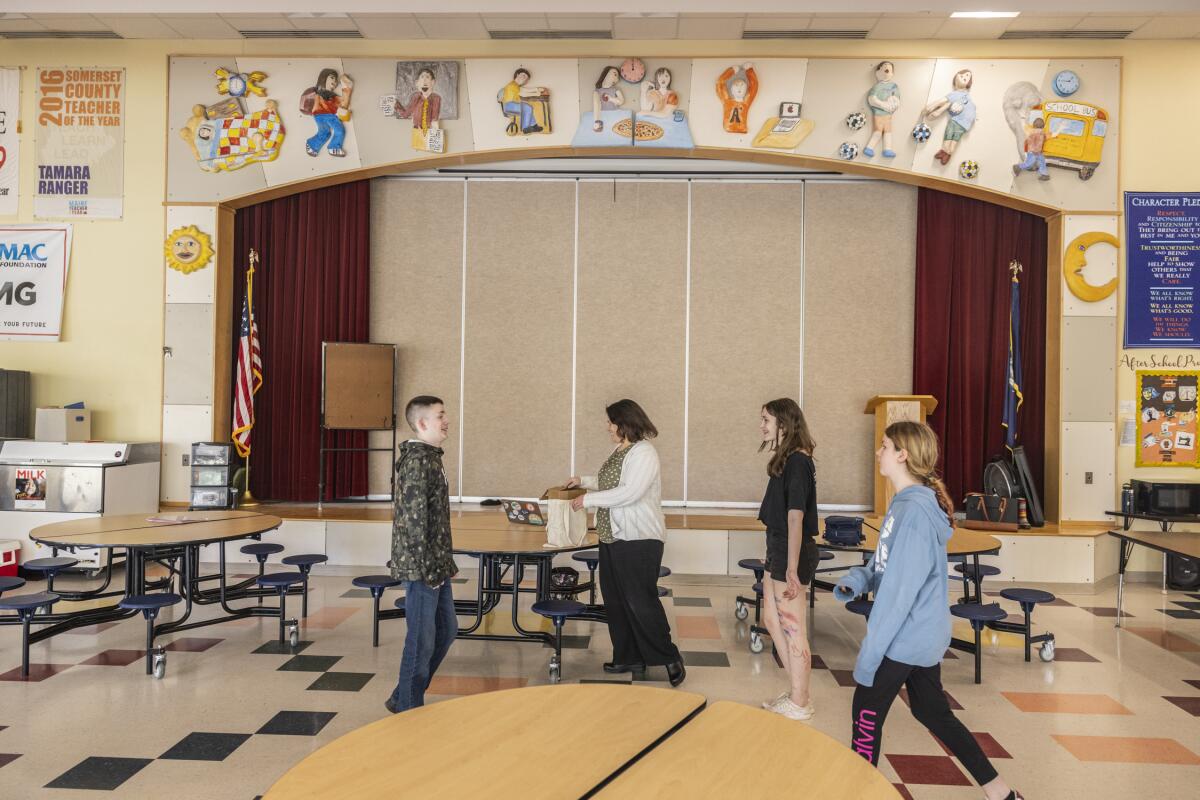 After they complete homework in the middle-school school cafeteria, students disperse into their various after-school clubs.