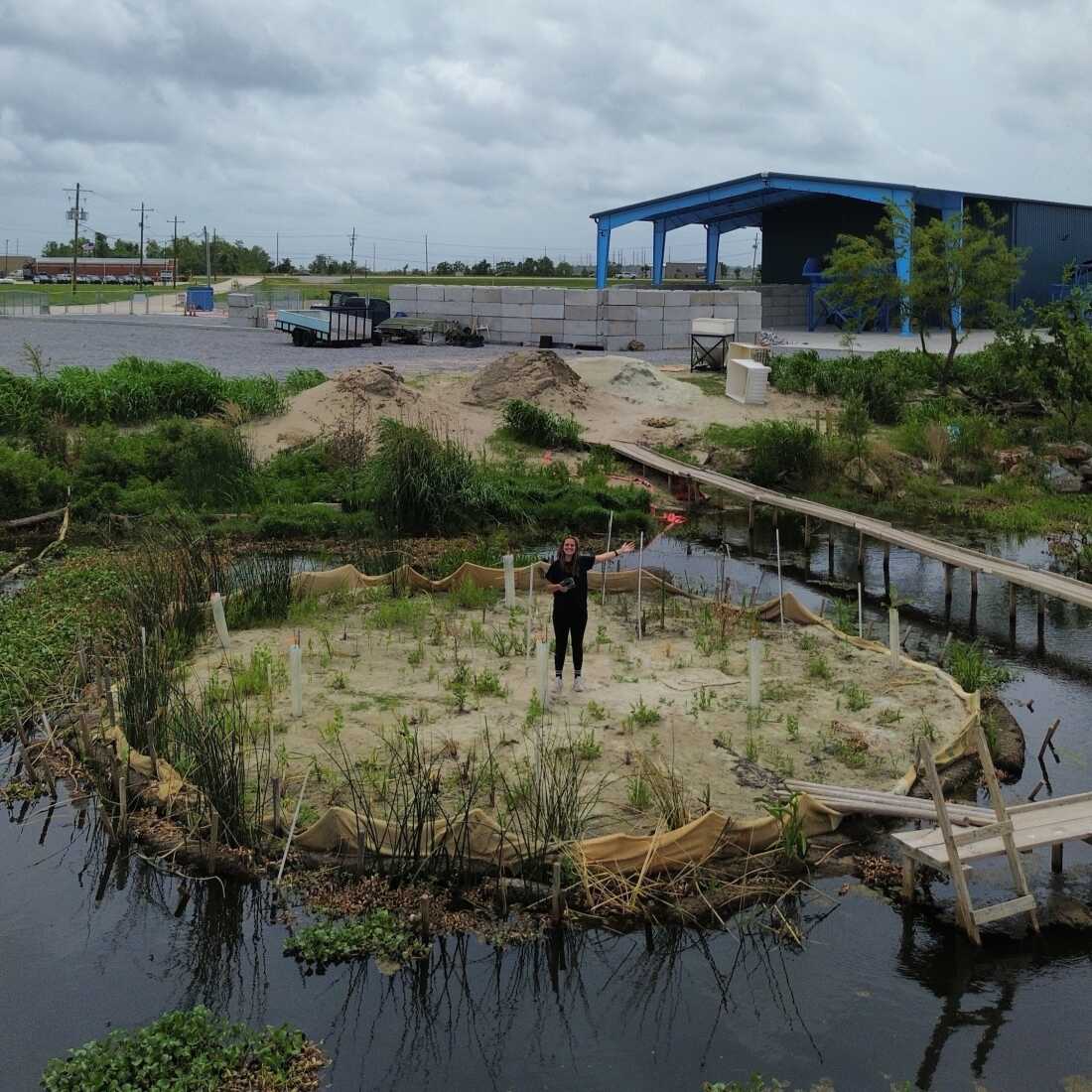 Franziska Trautmann stands on Glass Half Full's circular sandbank made of recycled.