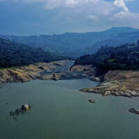 Forecasters are warning that a new El Niño weather pattern could bring strong impacts to areas around the world. In this 2024 photo, dramatically low water levels are seen in a reservoir feeding the Guavio Hydroelectric Power Plant in Gachalá, in Colombia's Guavio Province, during dry conditions linked to El Niño.