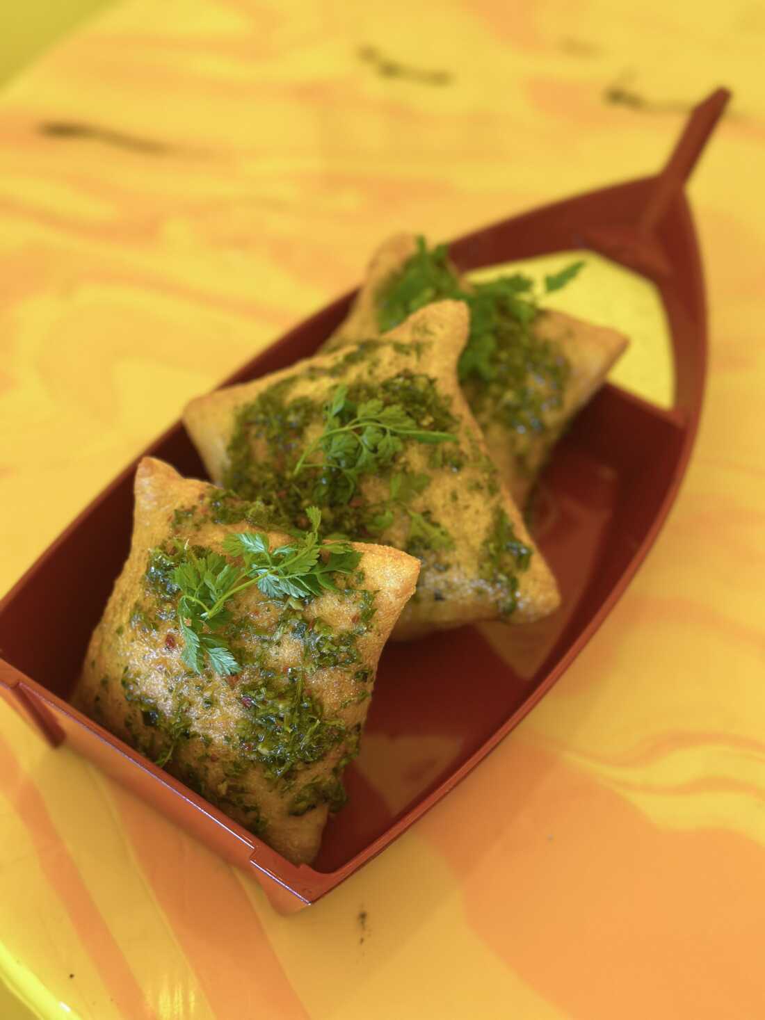 Chef David Murphy's Carrot Top Chimichurri sauce, showcased here on Shuggie's Pizza Puffs.