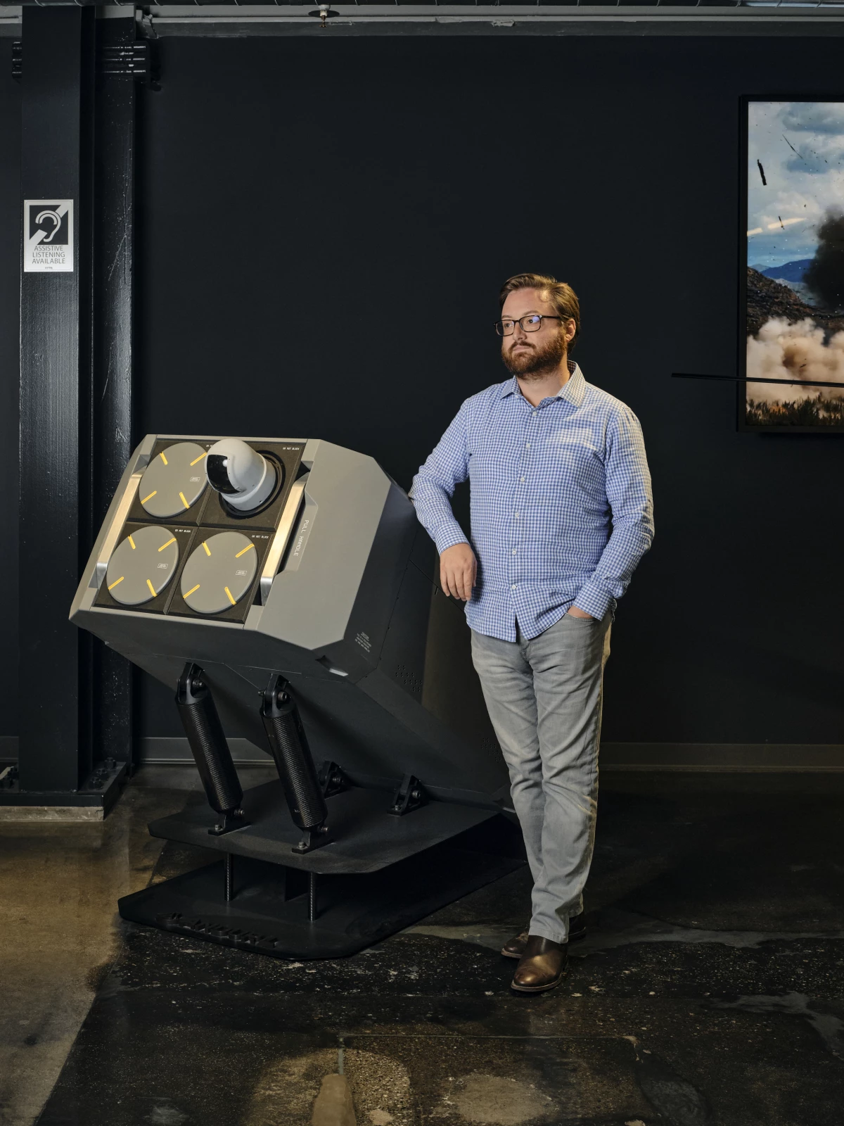 Brian Schimpf, the CEO of Anduril, stands next to a a launch system for the Altius drone at company headquarters. Schimpf acknowledges that operating in Ukraine is a challenge, but says Anduril's AI weapons are designed to be updated quickly to adapt to changing conditions.
