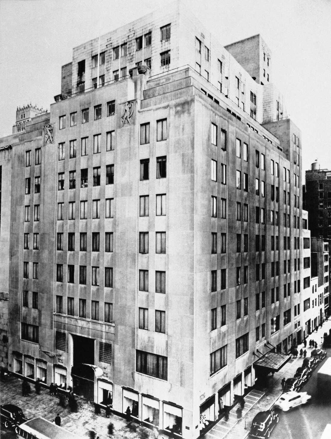 The Bonwit Teller Department store in New York City, with its art-deco sculptures framing the top row of windows below the balcony.