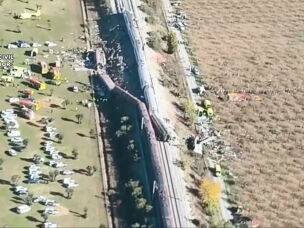 This framegrab taken from a video provided by Spain's Guardia Civil shows an aerial view of carriages and first responders on the site of a collision between two trains in Urda, Spain, Wednesday.