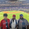 Jerad Castillo, a Texas Rangers fan, attended game one of the 2023 World Series. He bought a souvenir ticket for that game -- and it remains one of his favorite Rangers possessions. Castillo poses with his nephew Leo (left) and brother Lance (center) that night.