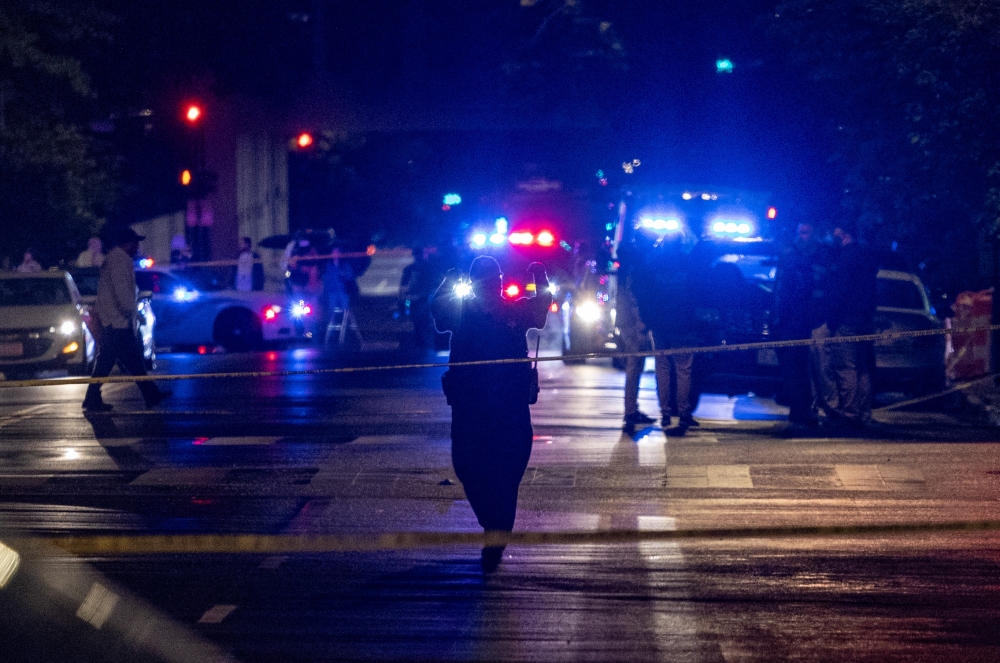 FBI agents and police officers work outside the Capital Jewish Museum in the early hours Thursday in Washington, D.C., following a shooting Wednesday night that left two people dead. (AFP via Getty Images)
