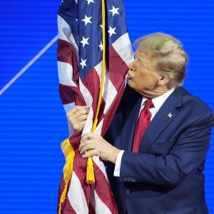 Before he was elected to a second termformer President Donald Trump hugged and kissed the U.S. flag as he spoke at the Conservative Political Action Conference at National Harborin Oxon HillMd.in 2024.